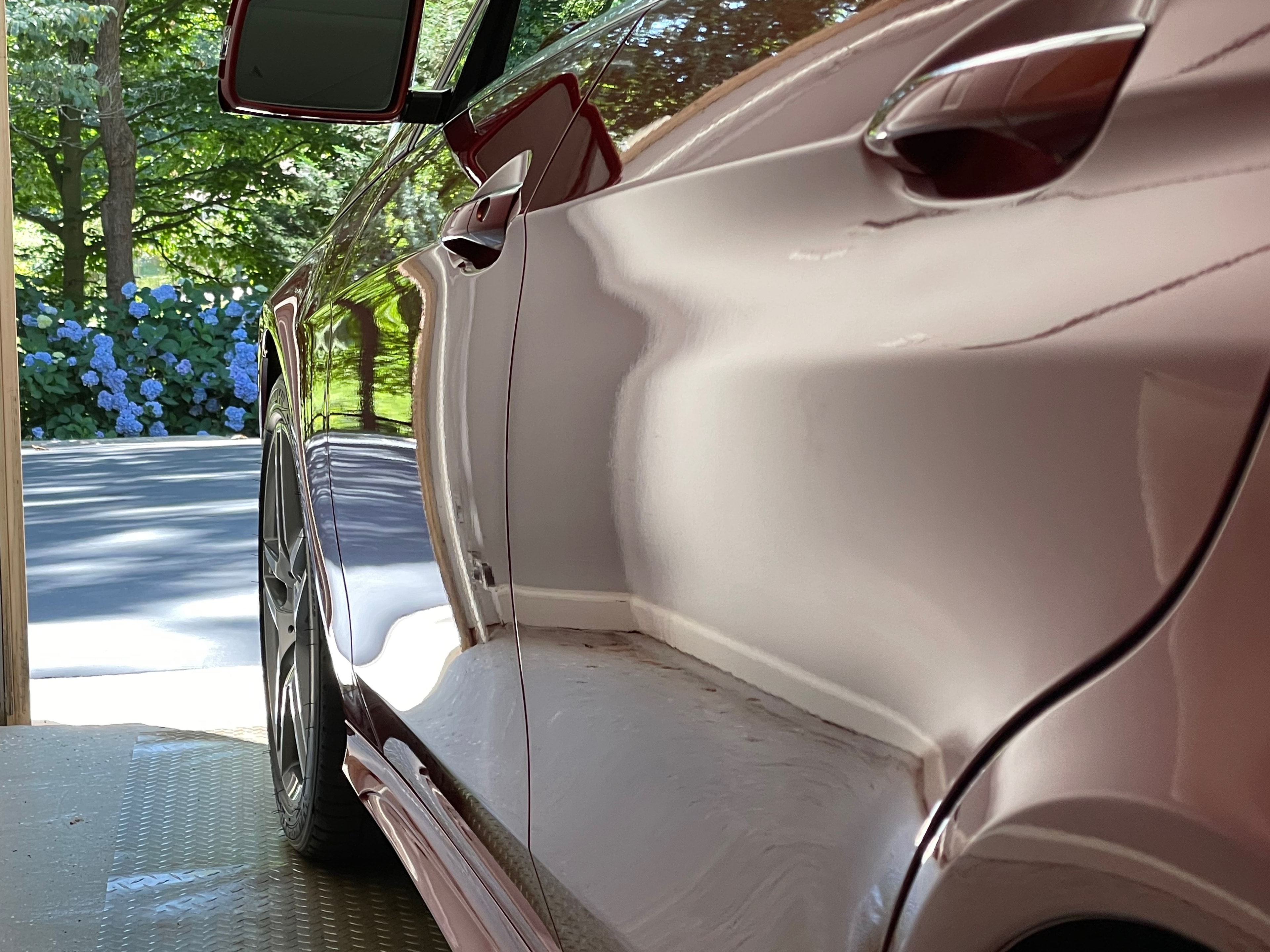 Professional ceramic coating application on luxury vehicle